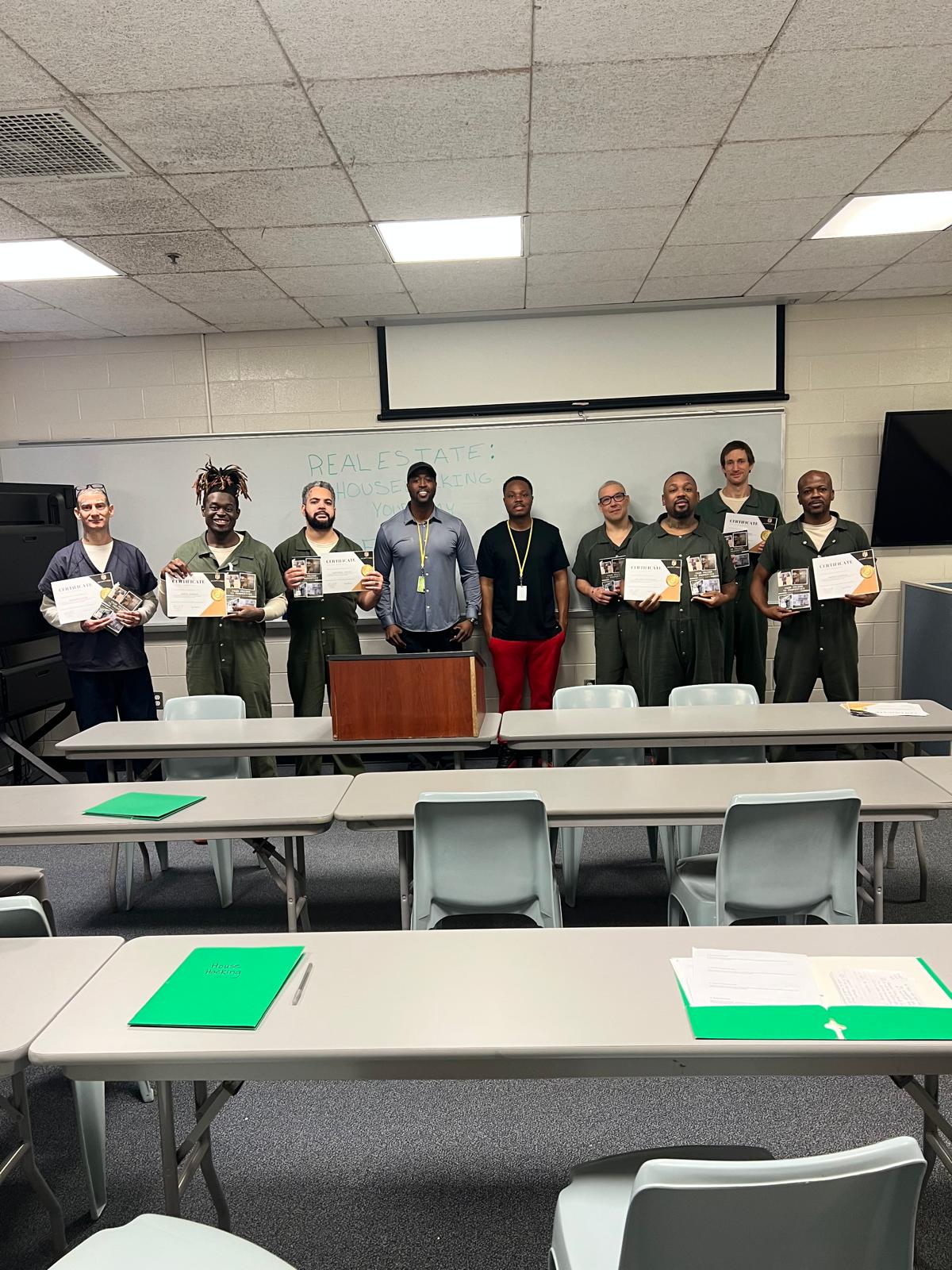 Program participants with certificates in classroom